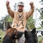 Joe Taylor, co-owner of Pinnacle German Shepards, gets his dogs to sit outside of their new temporary home at Rosecrest Equestrian Estate on Tuesday, Sept. 13, 2022 in Monroe, Washington. (Olivia Vanni / The Herald)