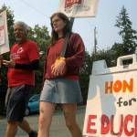 Guillermo Carvajal, a member of the support staff at Northgate Elementary School in Seattle, and Erin Carroll, an occupational therapist there, picket outside the building on the third day of a strike by the Seattle Education Association on, Sept. 9. The union and Seattle Public Schools continued negotiating over issued that include pay and support for special needs students. It remained unclear how long the strike might last. (AP Photo/Gene Johnson)