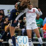 Everetts Isabella Nguon (left) and Snohomishs Jenna Edelbrock jump for a header Tuesday evening in Everett. (Kevin Clark / The Herald)