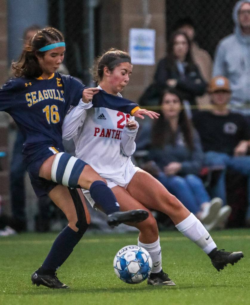 Everetts Sophia Churchill, left, and Snohomishs Hailey Kendall battle possession of the ball Tuesday evening in Everett, Washington on September 13, 2022. The Panthers defeated the Eagles 3-1. (Kevin Clark / The Herald)