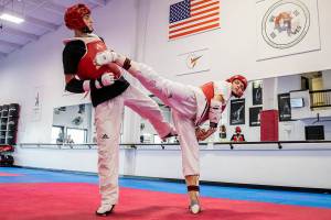Peter Sokolenko, left, and brother Ivan Sokolenko run through warm up exercises at Master JI’s TaeKwonDo Martial Arts School on Thursday, Sept. 8, 2022 in Monroe, Washington. (Olivia Vanni / The Herald)