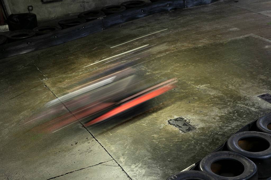 A racer speeds through the track at Traxx Indoor Raceway. (Ryan Berry / The Herald)