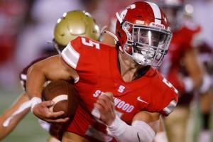 Stanwood’s Ryder Bumgarner takes a carry against Lakewood on Friday, Sep. 2, 2022, at Lakewood High School in Arlington, Washington. (Ryan Berry / The Herald)