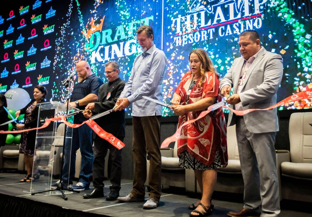 Tulalip board members, along with Randy Johnson and Johnny Avello cut a ribbon at the Tulalip DraftKings Sportsbook grand opening on Tuesday, in Tulalip. (Olivia Vanni / The Herald)