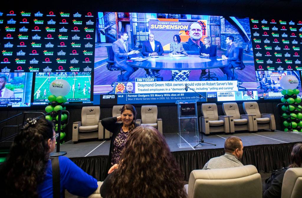 People wander through the new Tulalip DraftKings Sportsbook during the grand opening on Tuesday, in Tulalip. (Olivia Vanni / The Herald)