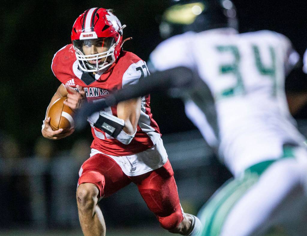 Marysville Pilchucks Joseph Davis runs the ball during the game against Marysville Getchell on Friday, Sept. 16, 2022 in Marysville, Washington. (Olivia Vanni / The Herald)
