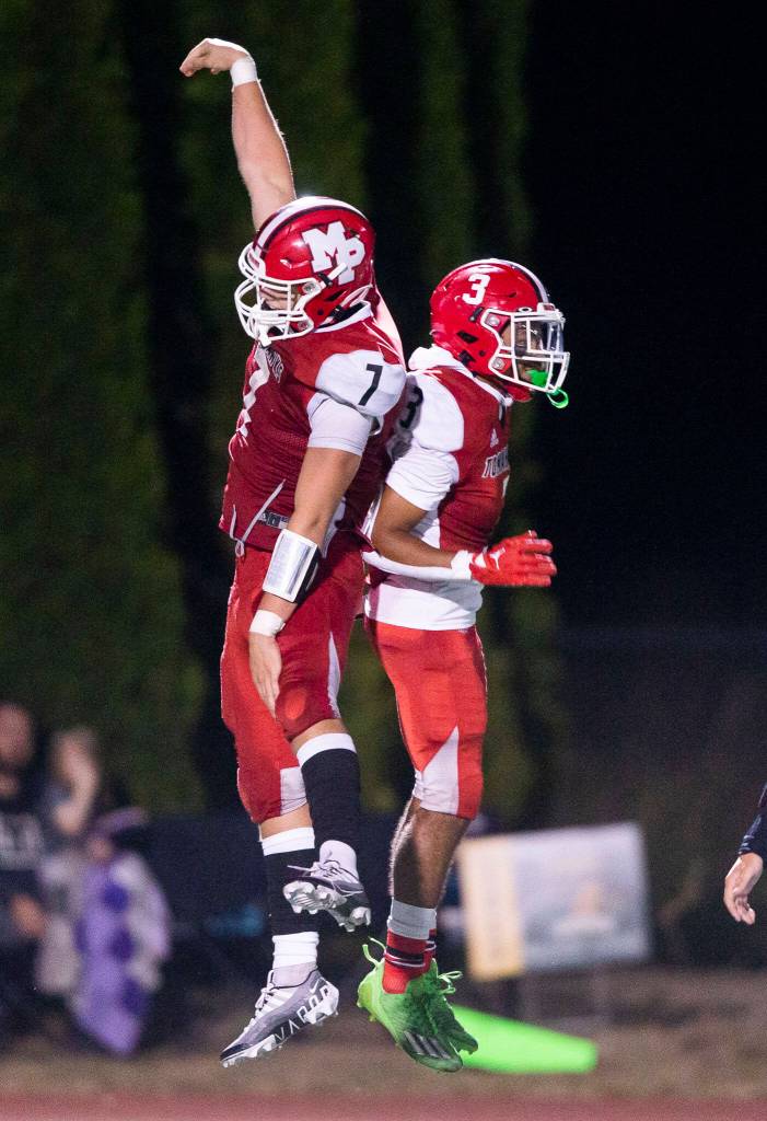 Marysville Pilchucks Christian Van Natta celebrates the touchdown by teammate Gaylan Gray during the game against Marysville Getchell on Friday, Sept. 16, 2022 in Marysville, Washington. (Olivia Vanni / The Herald)