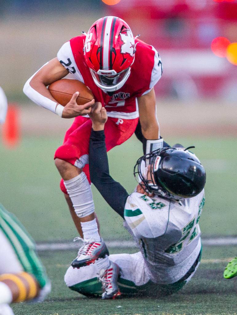 Marysville Pilchucks Joseph Davis is tackled during the game against Marysville Getchell on Friday, Sept. 16, 2022 in Marysville, Washington. (Olivia Vanni / The Herald)