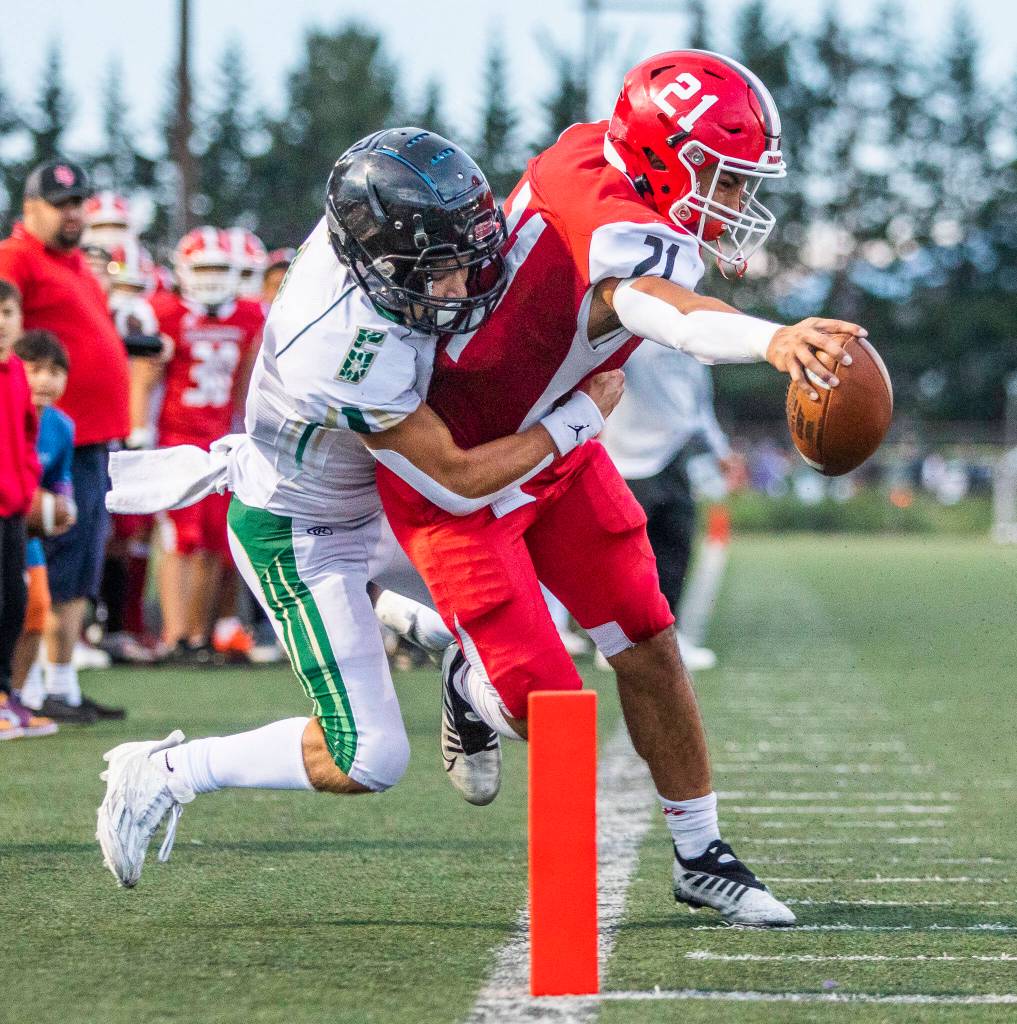 Marysville Pilchucks Kenai Sinaphet reaches out to try and cross into the end zone for a touchdown during the game against Maryville Getchell on Friday, Sept. 16, 2022 in Marysville, Washington. (Olivia Vanni / The Herald)