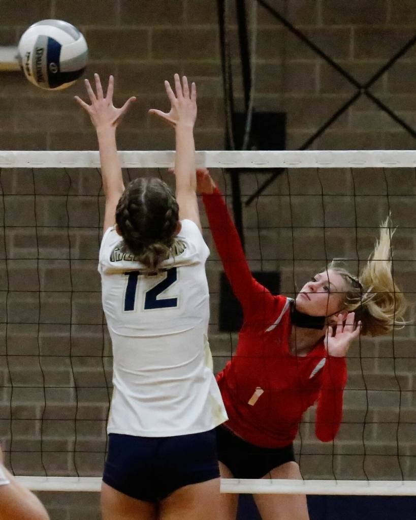 Snohomishs Kelsey Nichols attemps a kill against Arlington on Sept. 29, 2021, at Arlington High School. (Kevin Clark / The Herald)