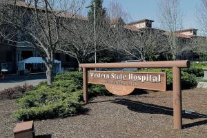 A sign near an entrance to Western State Hospital is shown Thursday, March 19, 2020, in Lakewood, Wash. (AP Photo/Ted S. Warren)