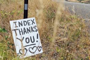 Handmade signs along U.S. 2 thanked firefighters for the efforts to control the Bolt Creek wildfire. (Edie Everette)