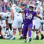 Michigan State linemen pick up quarterback Payton Thorne after Washington defensive lineman Zion Tupuola-Fetui (58) helped combine on a sack during the second quarter of a game Sept. 17 in Seattle. (Jennifer Buchanan/The Seattle Times via AP)