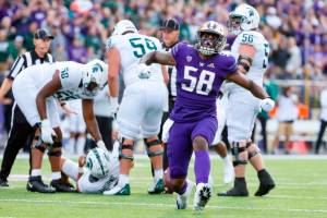 Michigan State linemen pick up quarterback Payton Thorne after Washington defensive lineman Zion Tupuola-Fetui (58) helped combine on a sack during the second quarter of an NCAA college football game Saturday, Sept. 17, 2022, in Seattle. (Jennifer Buchanan/The Seattle Times via AP)