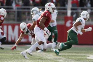 Washington State linebacker Daiyan Henley (1) follows a play during the second half of an NCAA college football game against Colorado State, Saturday, Sept. 17, 2022, in Pullman, Wash. (AP Photo/Young Kwak)