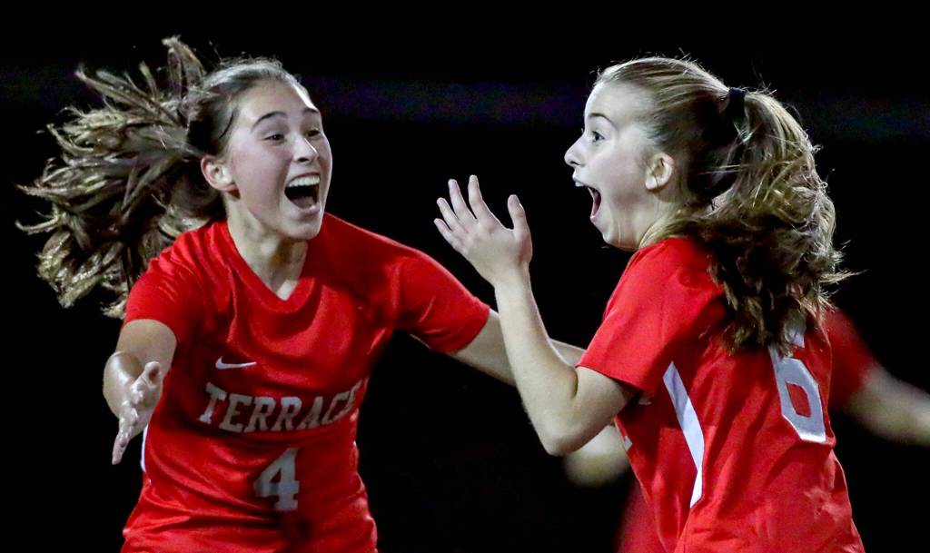 Mountlake Terraces Claire August, left, rushes to celebrate Laura Rices goal in the first half against Archbishop Murphy Thursday night at Lynnwood High School in Lynnwood, Washington on September 22, 2022. The Hawks and Wildcats finished the match with 1-1 tie. (Kevin Clark / The Herald)