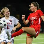 Archbishop Murphy's Georgia Franck, left, Mountlake Terrace's Claire August vie for control of a loose ball Thursday night at Lynnwood High School in Lynnwood, Washington on September 22, 2022. The Hawks and Wildcats finished the match with 1-1 tie. (Kevin Clark / The Herald)