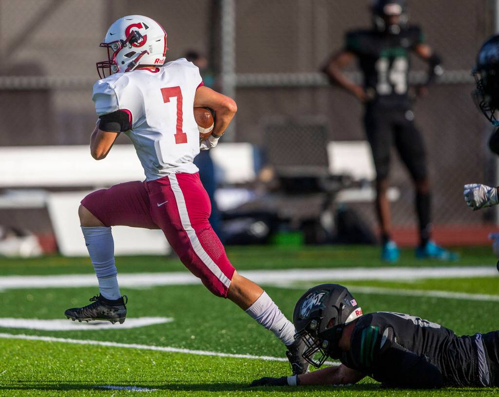 Cascades Zach Lopez escapes a tackle during the game against Jackson on Friday, Sept. 23, 2022 in Everett, Washington. (Olivia Vanni / The Herald)