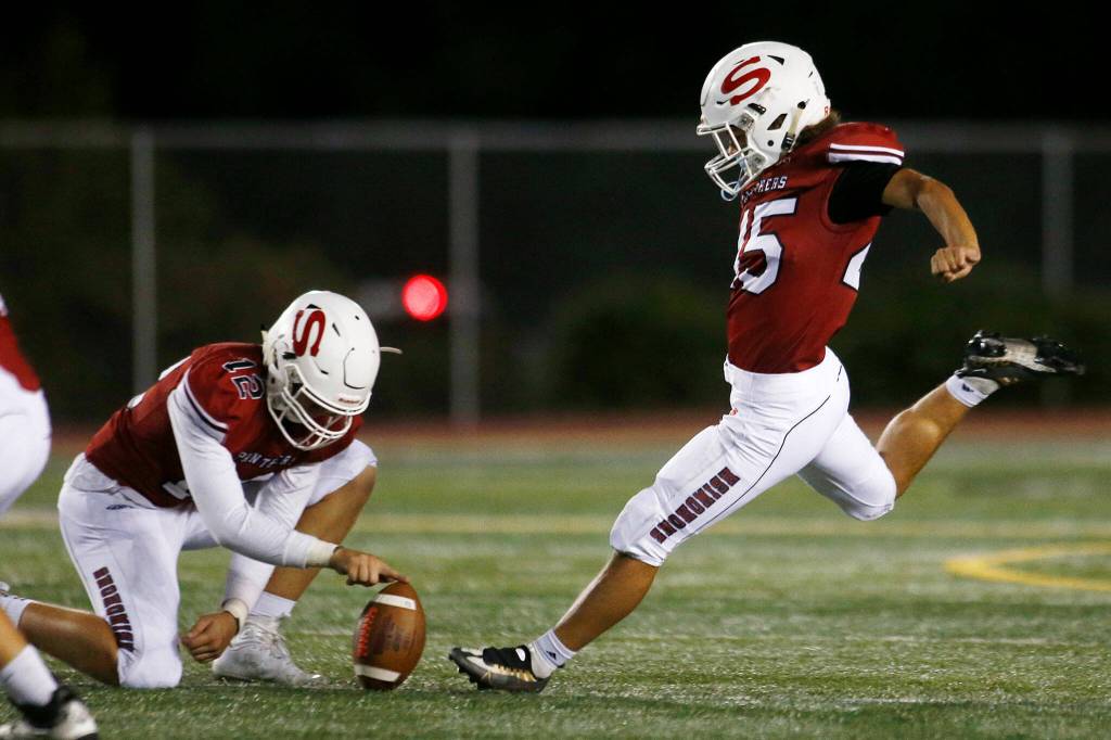Snohomishs Caleb Podoll nails a first-half kick against Edmonds-Woodway on Friday, Sep. 23, 2022, at Snohomish High School in Snohomish, Washington. (Ryan Berry / The Herald)