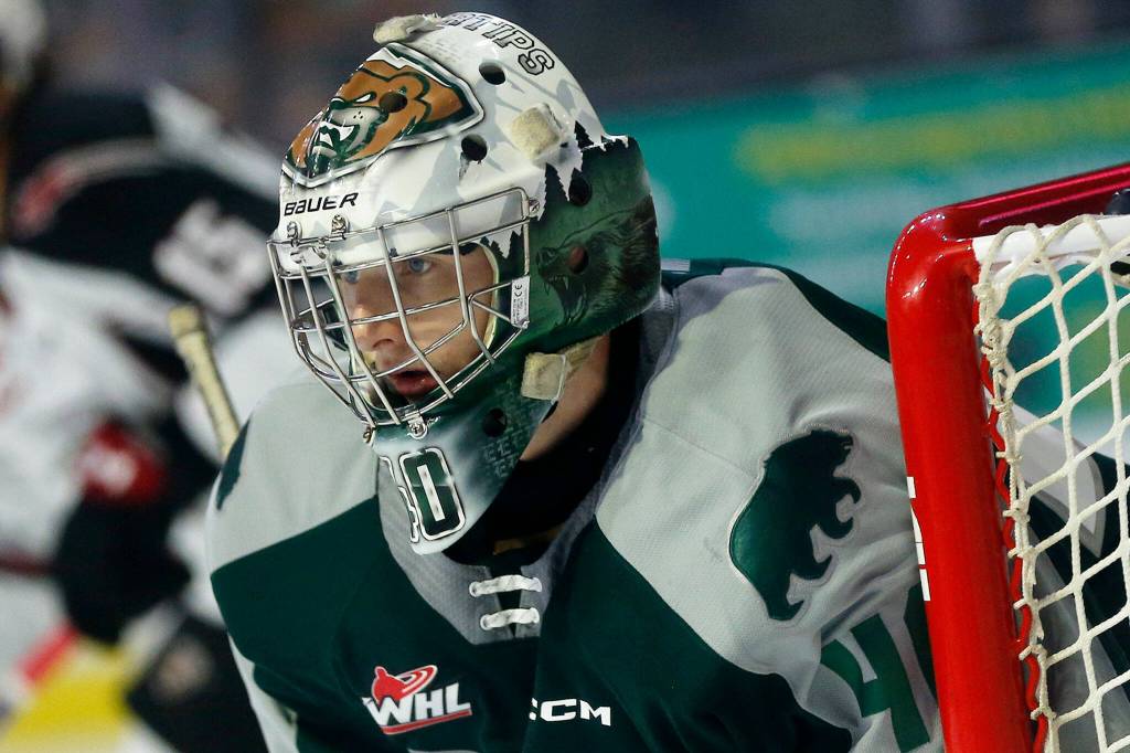 Everett Silvertips goaltender Braden Holt watches a play develop while in net during the season opener against the Vancouver Giants on Saturday, Sep. 24, 2022, at Angel of the Winds Arena in Everett, Washington. (Ryan Berry / The Herald)