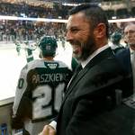 Dennis Williams, head coach and GM of the Everett Silvertips, shakes hands with an assistant coach at the end of a season opening victory over the Vancouver Giants on Saturday, Sep. 24, 2022, at Angel of the Winds Arena in Everett, Washington. (Ryan Berry / The Herald)