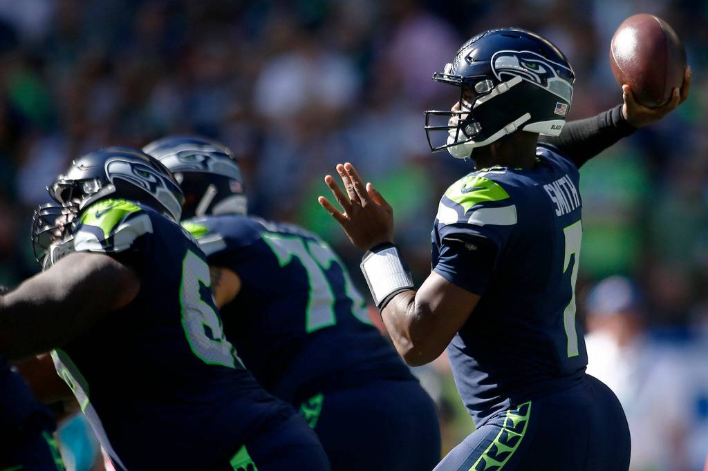 The Seattle Seahawks Geno Smith throws a pass against the Atlanta Falcons on Sunday, Sep. 25, 2022, at Lumen Field in Seattle, Washington. (Ryan Berry / The Herald)