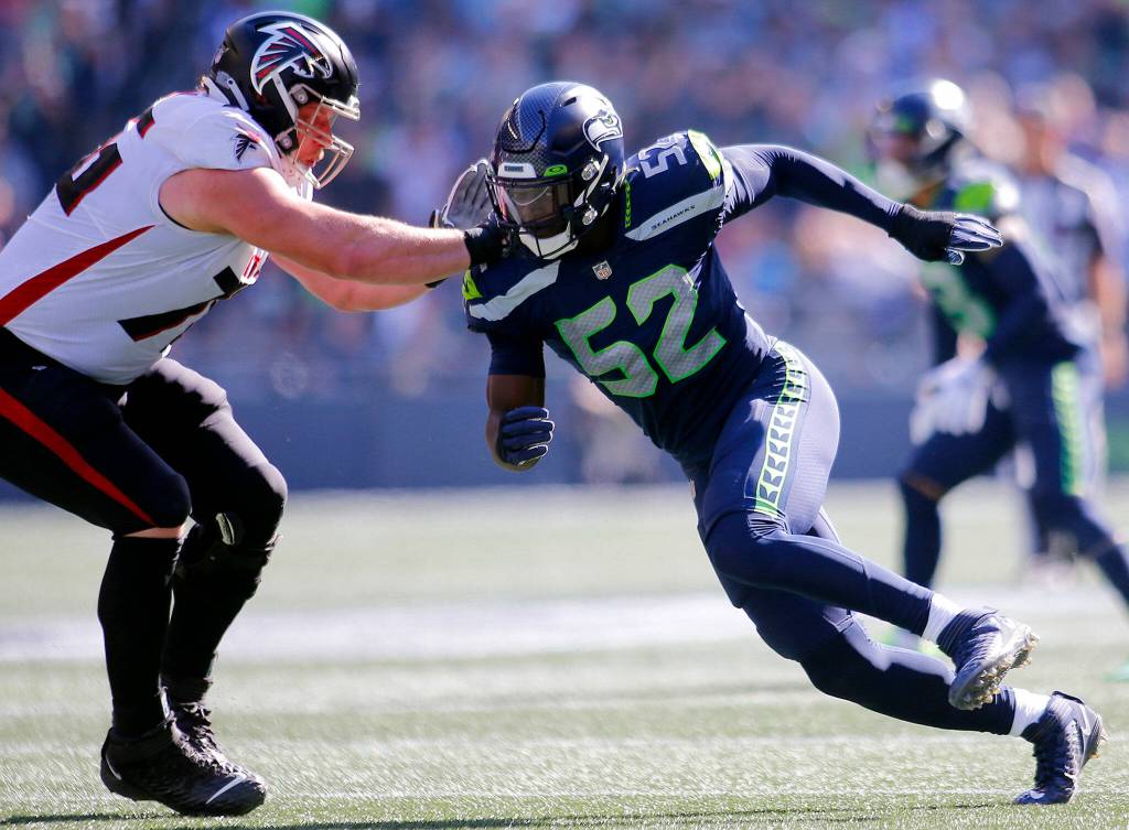 The Seattle Seahawks Darrell Taylor tries to beat a lineman around the edge against the Atlanta Falcons on Sunday, Sep. 25, 2022, at Lumen Field in Seattle, Washington. (Ryan Berry / The Herald)