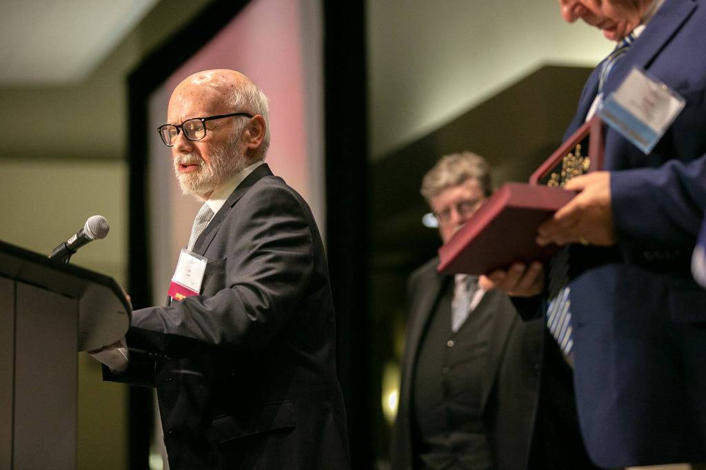 Retired football referee Jim Carter delivers a speech after being inducted during the 2022 Snohomish County Sports Hall of Fame banquet Wednesday, Sep. 28, 2022, at the Edward D. Hansen Conference Center in Everett, Washington. (Ryan Berry / The Herald)