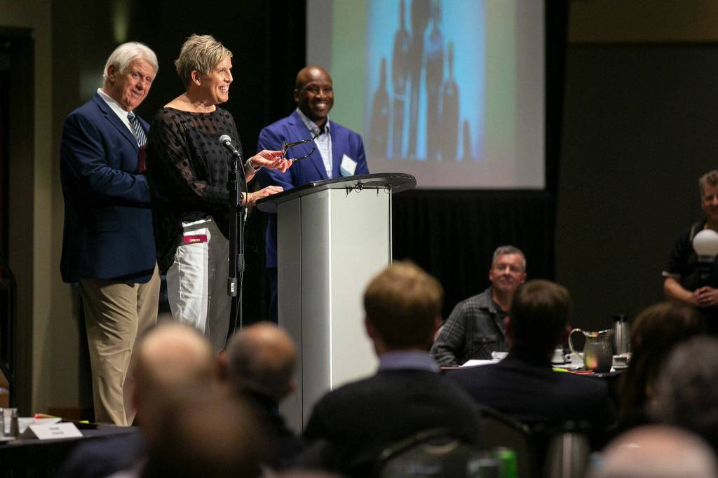 Carol Quarterman Kummerle access her Hall of Fame honor during the 2022 Snohomish County Sports Hall of Fame banquet Wednesday, Sep. 28, 2022, at the Edward D. Hansen Conference Center in Everett, Washington. (Ryan Berry / The Herald)
