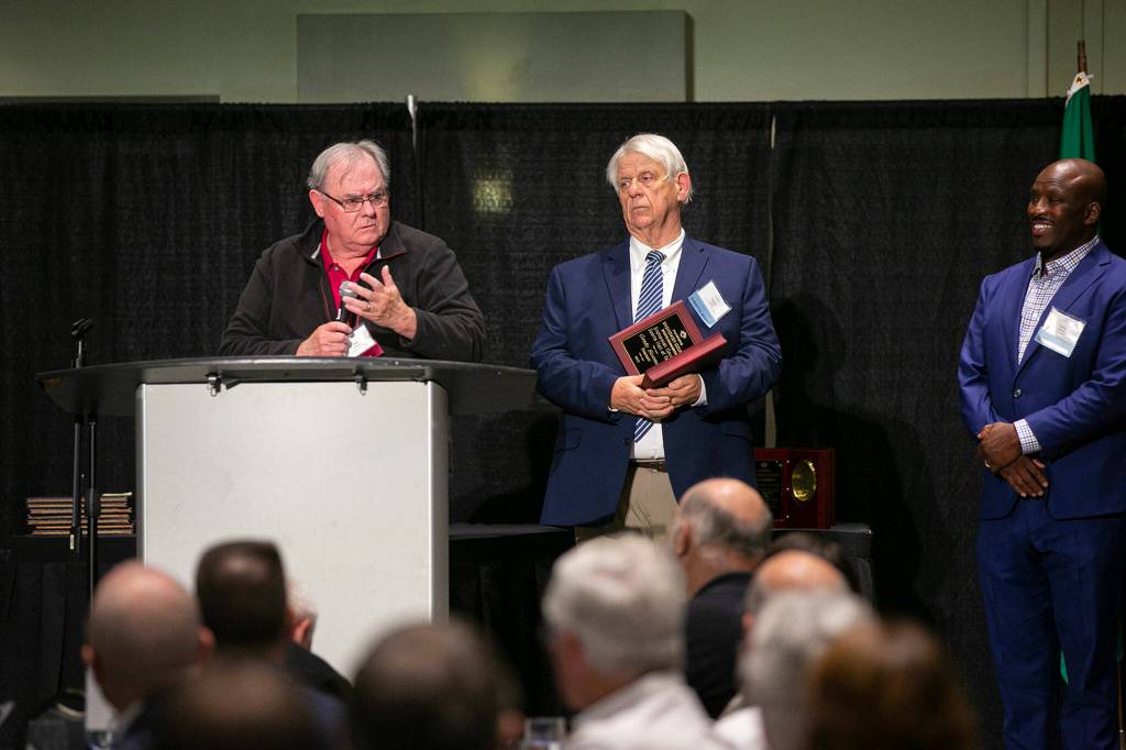 Bob Smithson, former high school coach of MLB All Star Grady Sizemore, accepts a Hall of Fame induction on behalf of Sizemore during the 2022 Snohomish County Sports Hall of Fame banquet Wednesday, Sep. 28, 2022, at the Edward D. Hansen Conference Center in Everett, Washington. (Ryan Berry / The Herald)