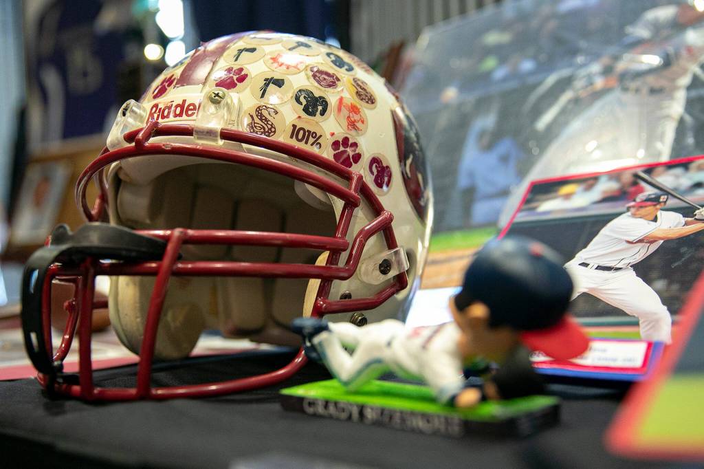 Grady Sizemores high school football helmet is on display during the 2022 Snohomish County Sports Hall of Fame banquet Wednesday, Sep. 28, 2022, at the Edward D. Hansen Conference Center in Everett, Washington. (Ryan Berry / The Herald)