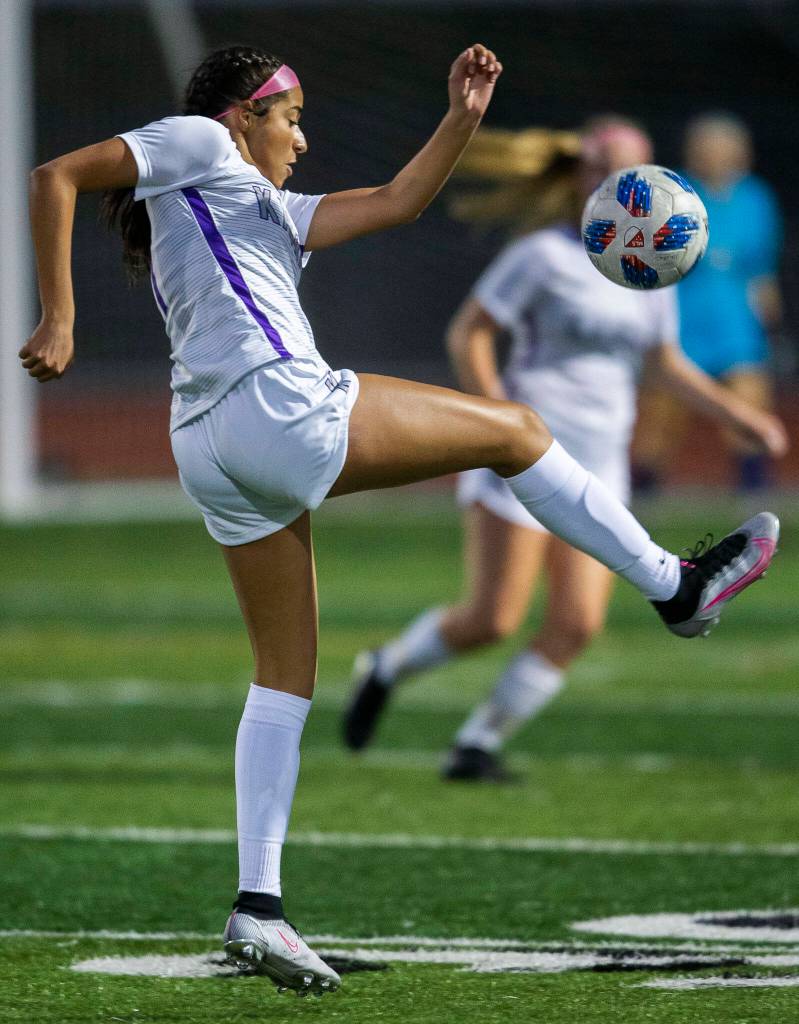 Kamiaks Bailey Gourdine leaps to kick the ball during the game against Glacier Peak on Thursday, Sept. 29, 2022 in Snohomish, Washington. (Olivia Vanni / The Herald)
