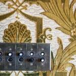 Push button light switch surrounded by velvet wall coverings at the Rucker Mansion on Oct. 11 in Everett. (Kevin Clark / The Herald)