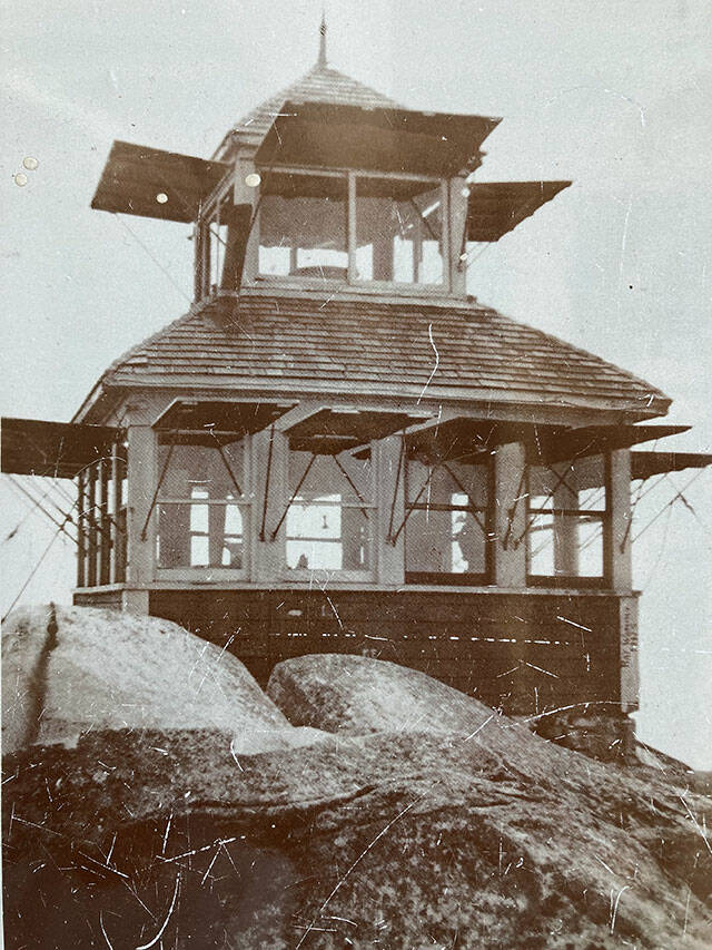 Taken in 1921, this photo of the original Pilchuck fire lookout is displayed inside the restored structure. (Photo provided)
