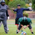 Boni Weasley, head coach, arranges player coverage during practice on Sept. 3, in Shoreline. (Kevin Clark / The Herald)
