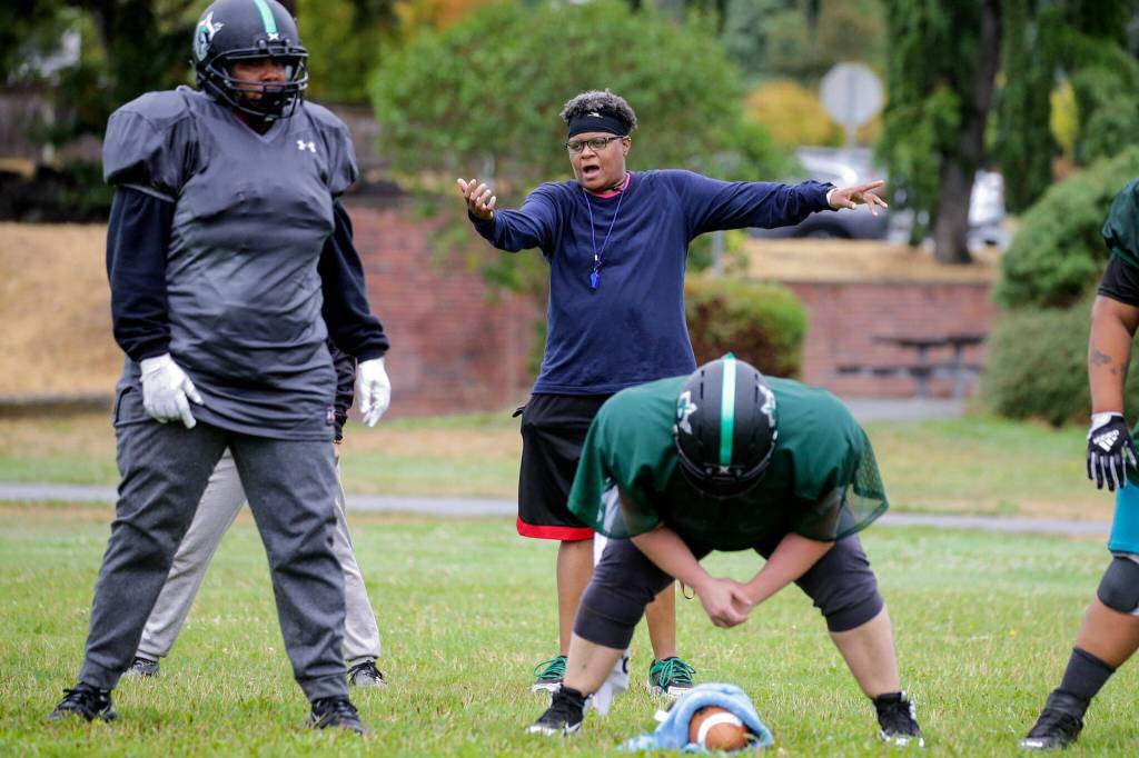 Boni Weasley, head coach, arranges player coverage during practice on Sept. 3, in Shoreline. (Kevin Clark / The Herald)