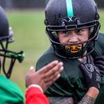 Yolly Delgado, right, get route help from Phaedra Keaton during practice on Sept. 3, in Shoreline. (Kevin Clark / The Herald)