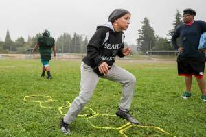 Nicole Pelham, owner and player, of the Seattle Spartans runs through drills during practice Saturday morning in Shoreline, Washington on September 3, 2022. (Kevin Clark / The Herald)