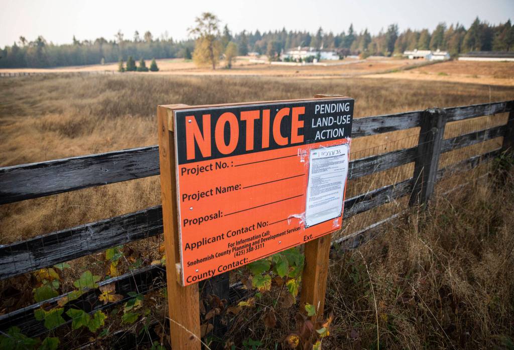 A notice for a proposed mental health treatment center on Thursday at 300th Street NW and 80th Avenue NW north of Stanwood. (Olivia Vanni / The Herald)