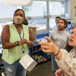 Tanya King, left, looks to where Hailey Newton, right, ask to hang her project Thursday afternoon at Beverly Elementary in Lynnwood, Washington on September 14, 2022. (Kevin Clark / The Herald)