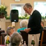 Former TV food personality Graham Kerr mingles with residents of Windsor Square Retirement Community before giving a presentation in Marysville. (Ryan Berry / The Herald)