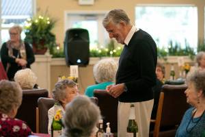 Former television food personality Graham Kerr meets with residents of Windsor Square Senior Living before giving a presentation on Thursday, Sep. 15, 2022, in Marysville, Washington. (Ryan Berry / The Herald)