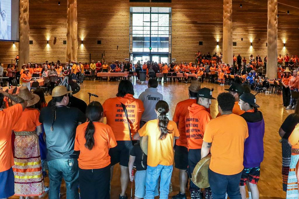 Hundreds tribal members and guests gather for the National Day for Truth and Reconciliation and Orange Shirt Day assemble Friday evening at Tulalip Gathering Hall on Sept. 30, in Tulalip. (Kevin Clark / The Herald)