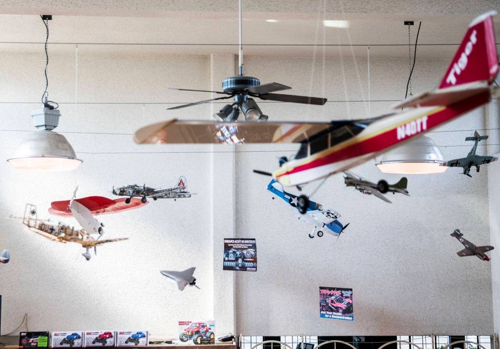 Model airplanes hang from the ceiling of Broadway Hobbies on Sept. 26, in Everett. (Olivia Vanni / The Herald)