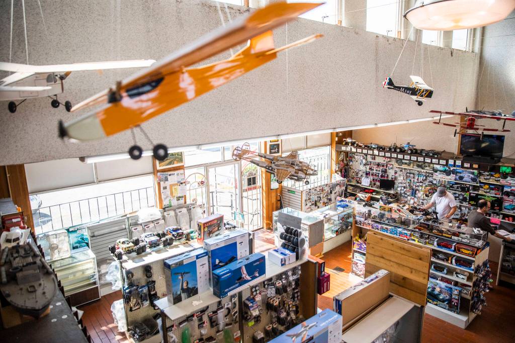 Customers get helped at the counter inside Broadway Hobbies on Sept. 26, in Everett. (Olivia Vanni / The Herald)