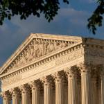 FILE - The U.S. Supreme Court building is shown on May 4, 2022, in Washington. The Supreme Court says it will continue providing live audio broadcasts of arguments in cases, even as it welcomes the public back to its courtroom for a new term that begins Monday. (AP Photo/Alex Brandon, File)