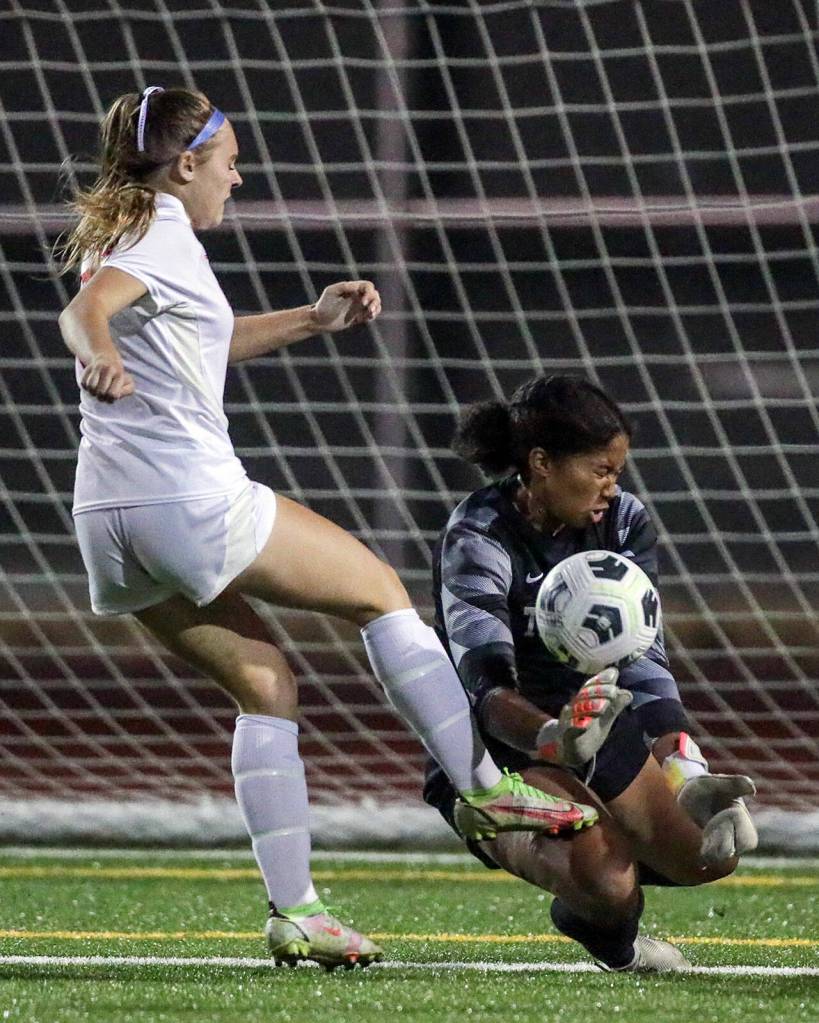 Mountlake Terraces Sierra Sonko gathers a shot during a game against Archbishop Murphy on Sept. 22 at Lynnwood High School. (Kevin Clark / The Herald)
