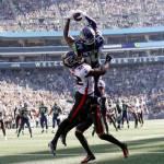 Seattle Seahawks wide receiver DK Metcalf, above, makes a catch in the end zone for a touchdown as Atlanta Falcons safety Jaylinn Hawkins defends during the first half of an NFL football game Sunday, Sept. 25, 2022, in Seattle. (AP Photo/John Froschauer)