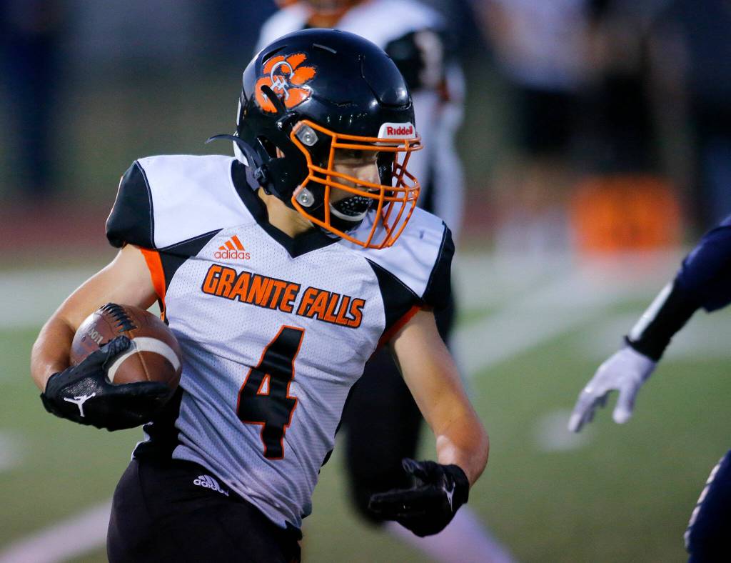 Granite Falls Landon Ferwerda tries to turn the corner against Sultan on Friday, Sep. 30, 2022, at Sultan High School in Sultan, Washington. (Ryan Berry / The Herald)