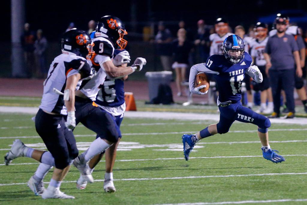 Sultans Derek Feltner beats the defense to the edge before fighting his way into thee end zone and scoring the game-winning touchdown against Granite Falls on Friday, Sep. 30, 2022, at Sultan High School in Sultan, Washington. (Ryan Berry / The Herald)